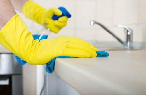 Technician preparing a carpet for steam carpet cleaning in